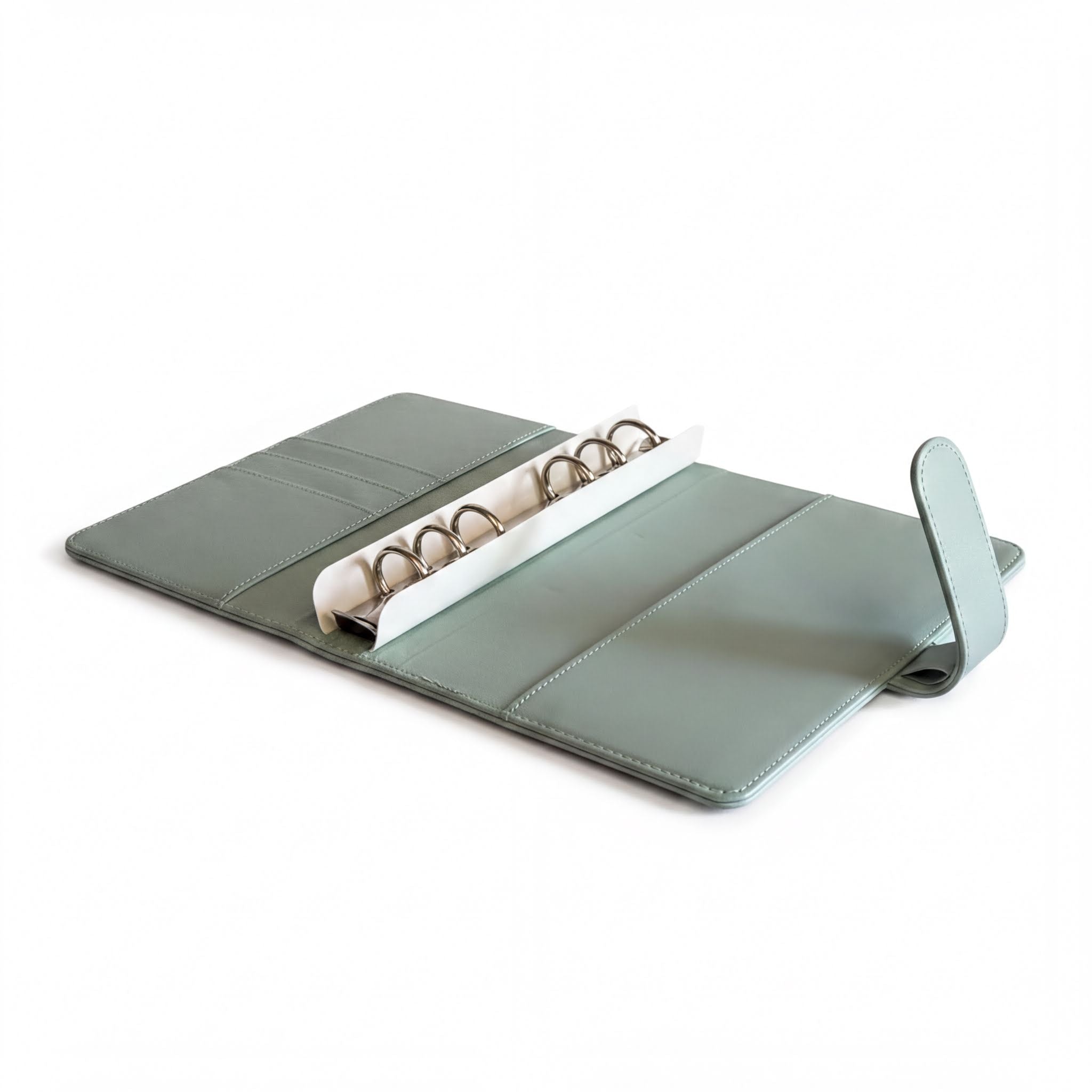 A light green leather binder or folder with a metal ring holder inside, placed on a white background.