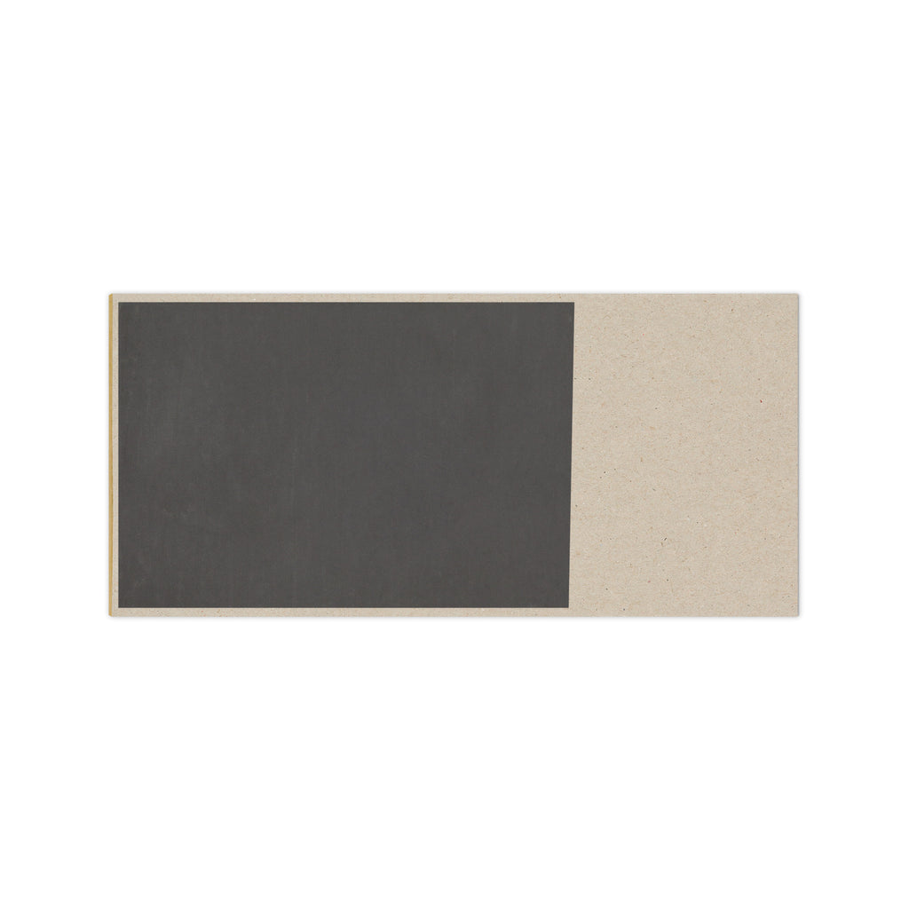 Handcrafted natural soap bar with dark charcoal and light beige tones, made with goat milk and natural ingredients.