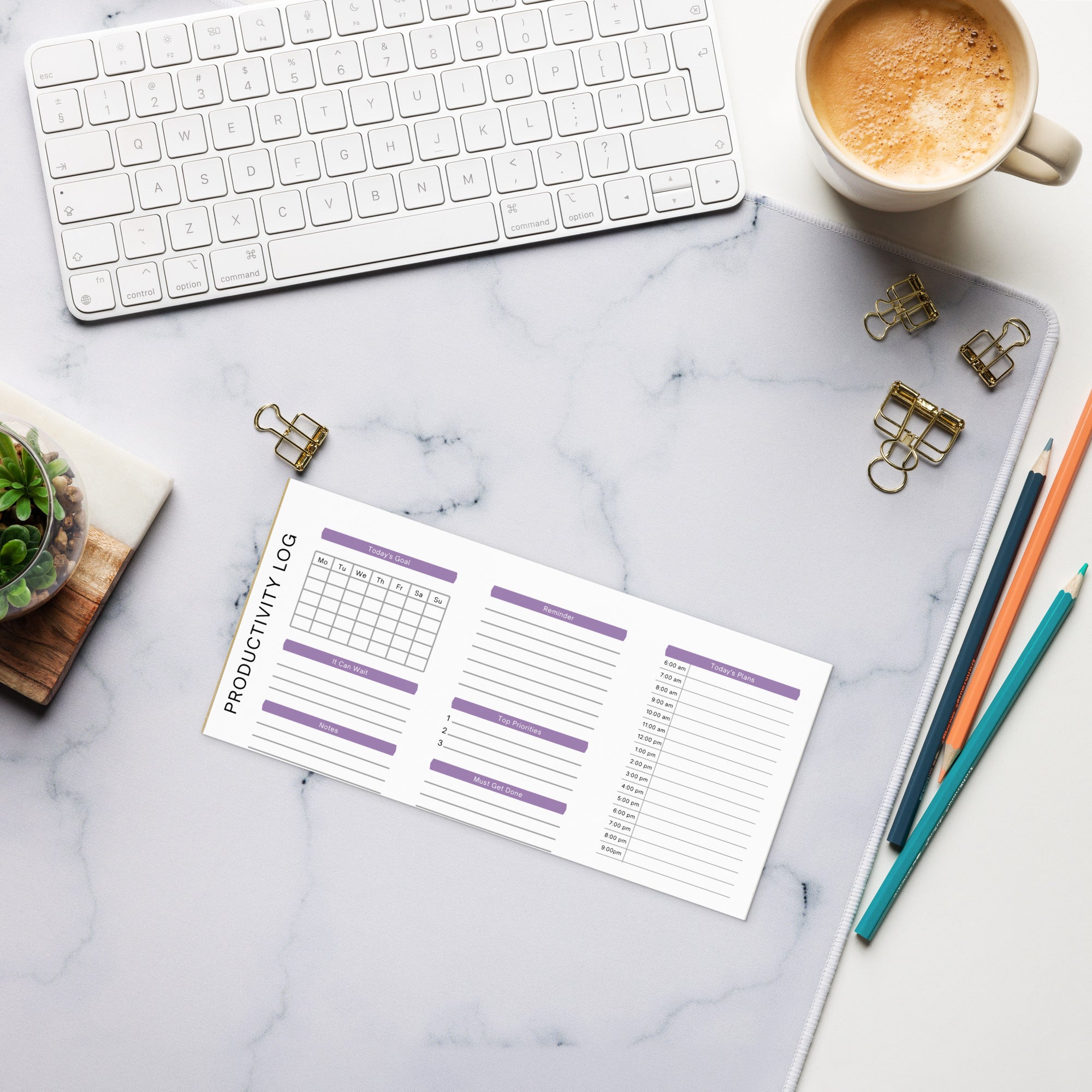 Productivity log planner on marble desk with keyboard, coffee, and pencils for organized daily planning